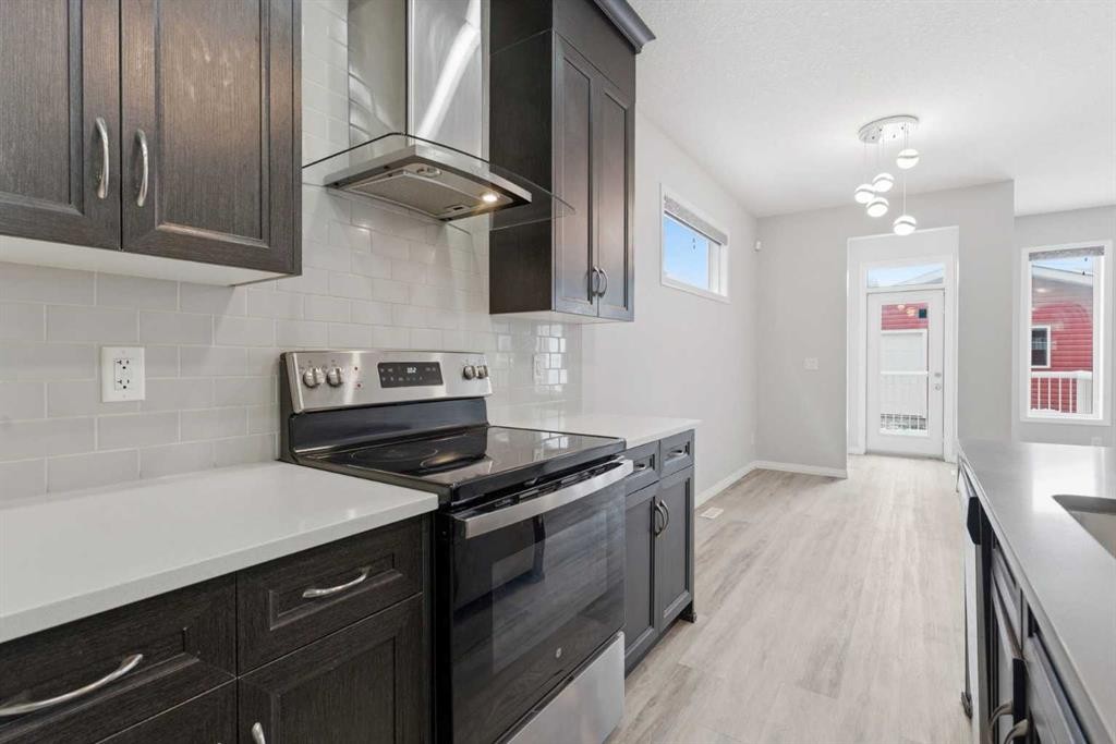 730 Redstone Drive Ne, Calgary, AB - Indoor Photo Showing Kitchen With Upgraded Kitchen