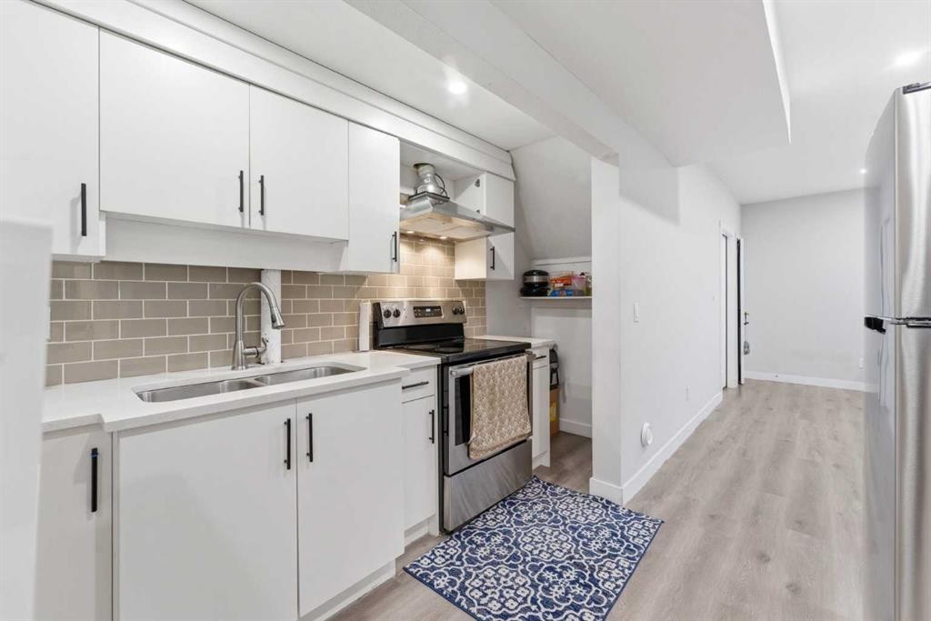 730 Redstone Drive Ne, Calgary, AB - Indoor Photo Showing Kitchen With Double Sink