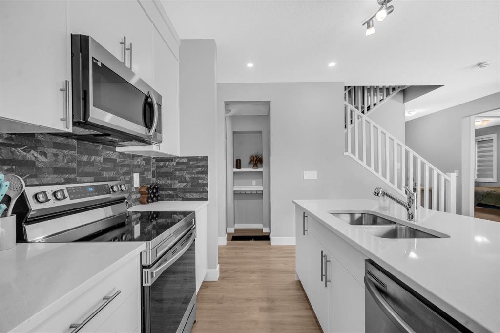 155 Carringham Way Nw, Calgary, AB - Indoor Photo Showing Kitchen With Double Sink With Upgraded Kitchen
