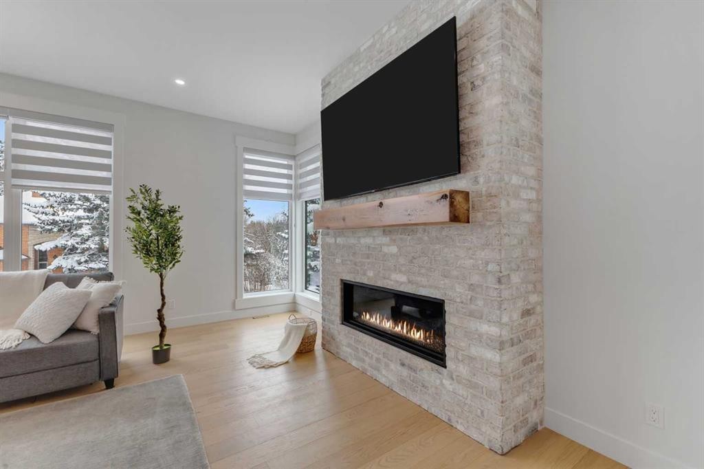 30 Roselawn Crescent Nw, Calgary, AB - Indoor Photo Showing Living Room With Fireplace