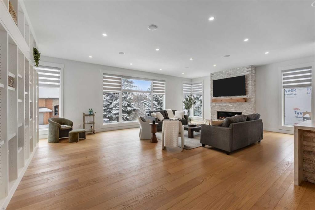 30 Roselawn Crescent Nw, Calgary, AB - Indoor Photo Showing Living Room With Fireplace