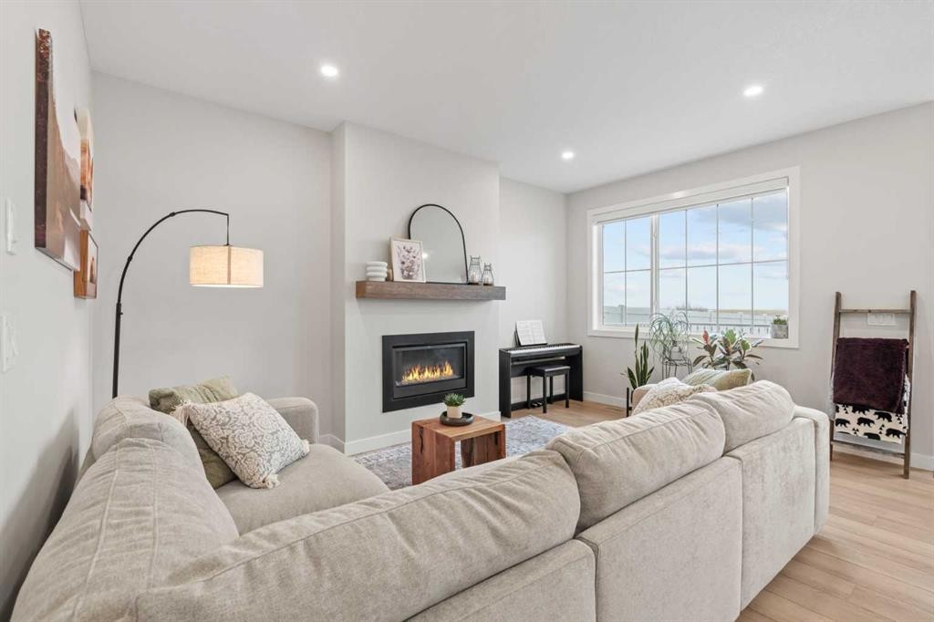 60 Ranchers View, Okotoks, AB - Indoor Photo Showing Living Room With Fireplace