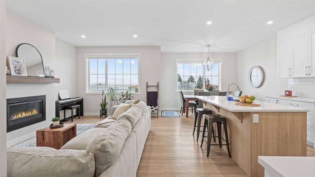 60 Ranchers View, Okotoks, AB - Indoor Photo Showing Living Room With Fireplace