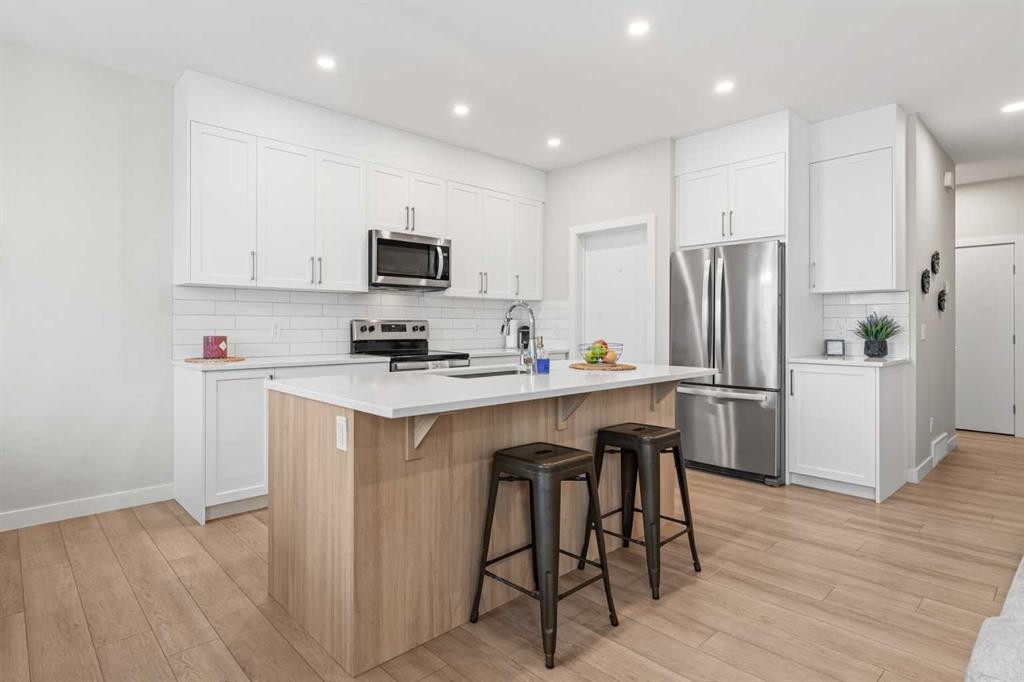 60 Ranchers View, Okotoks, AB - Indoor Photo Showing Kitchen With Stainless Steel Kitchen With Upgraded Kitchen