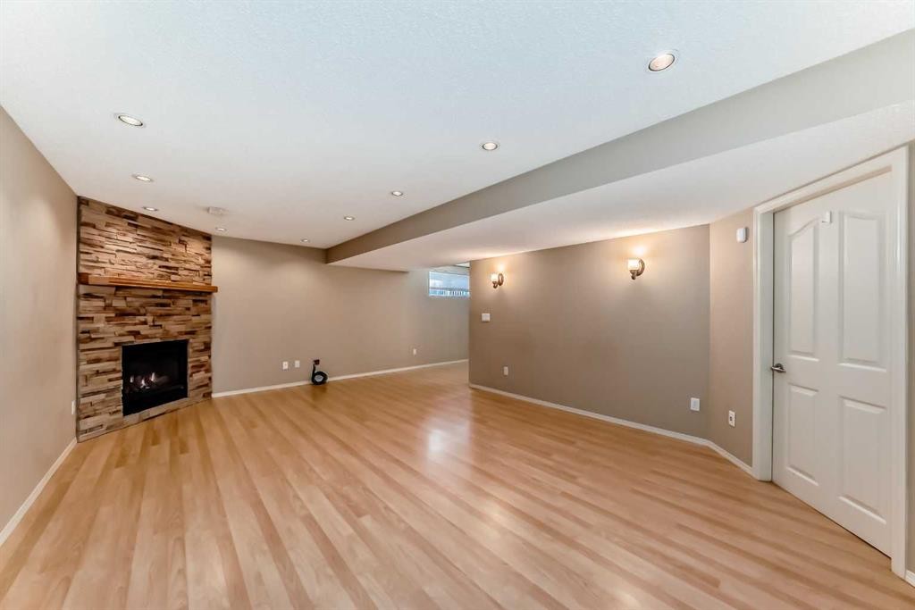 131 Somerside Crescent Sw, Calgary, AB - Indoor Photo Showing Other Room With Fireplace