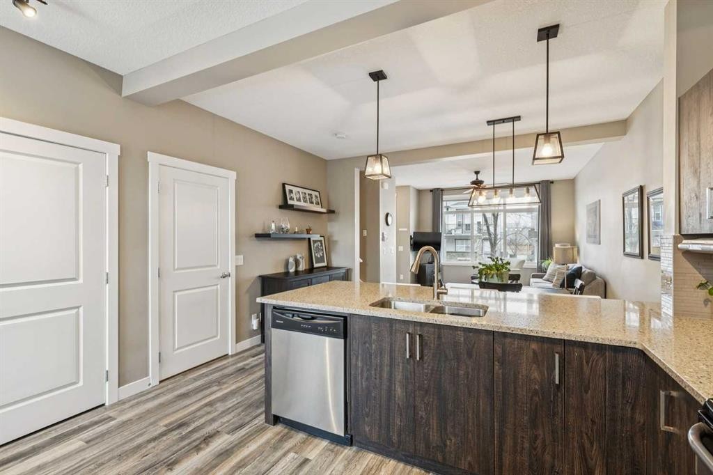 166 Legacy Common Se, Calgary, AB - Indoor Photo Showing Kitchen With Double Sink With Upgraded Kitchen