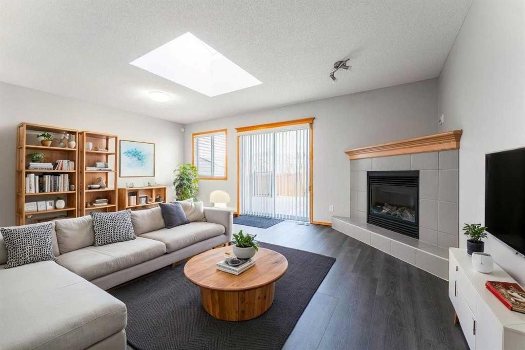 14 Taralea Bay Ne, Calgary, AB - Indoor Photo Showing Living Room With Fireplace