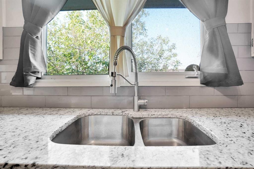 4764 Rundlewood Drive Ne, Calgary, AB - Indoor Photo Showing Kitchen With Double Sink
