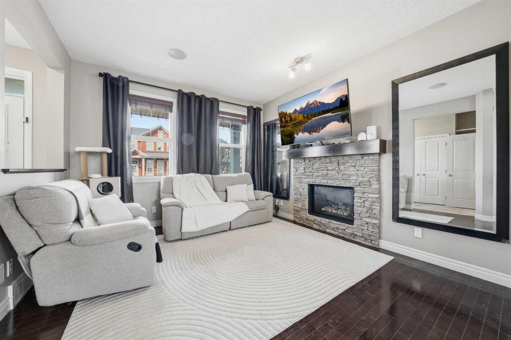 67 Evanspark Road Nw, Calgary, AB - Indoor Photo Showing Living Room With Fireplace