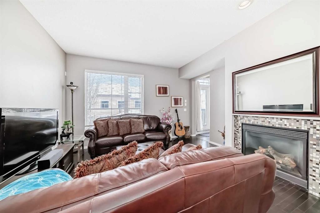 188 Chapalina Square Se, Calgary, AB - Indoor Photo Showing Living Room With Fireplace