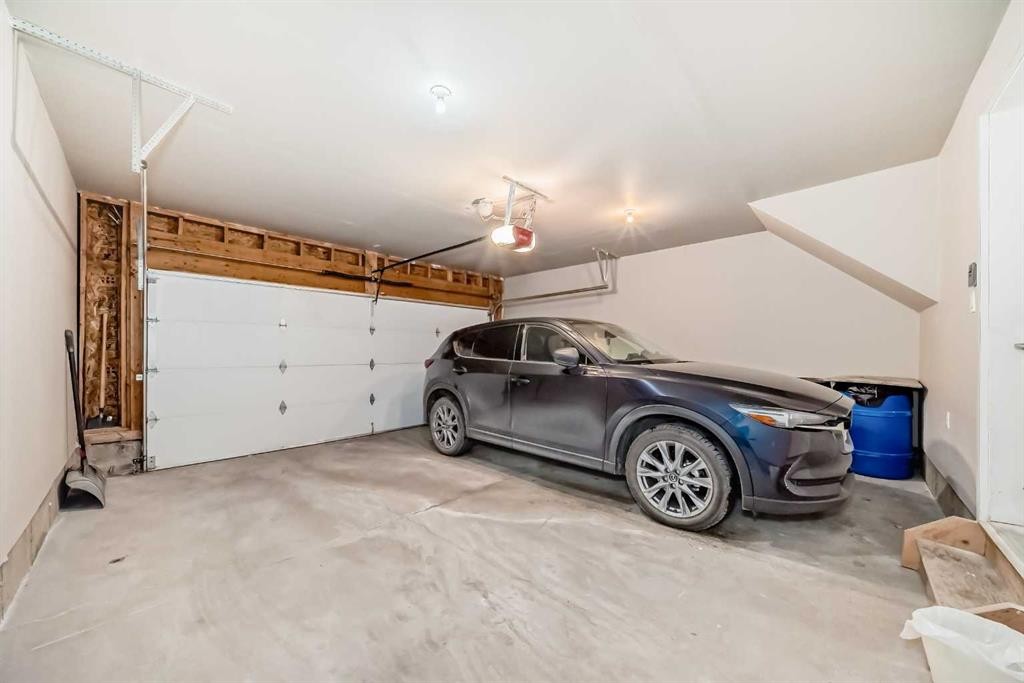 188 Chapalina Square Se, Calgary, AB - Indoor Photo Showing Garage