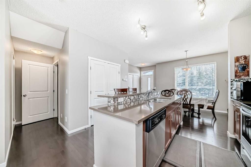188 Chapalina Square Se, Calgary, AB - Indoor Photo Showing Kitchen With Double Sink