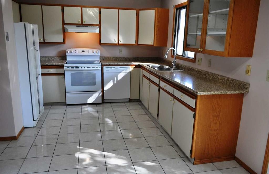 319 Woodside Circle Sw, Calgary, AB - Indoor Photo Showing Kitchen With Double Sink