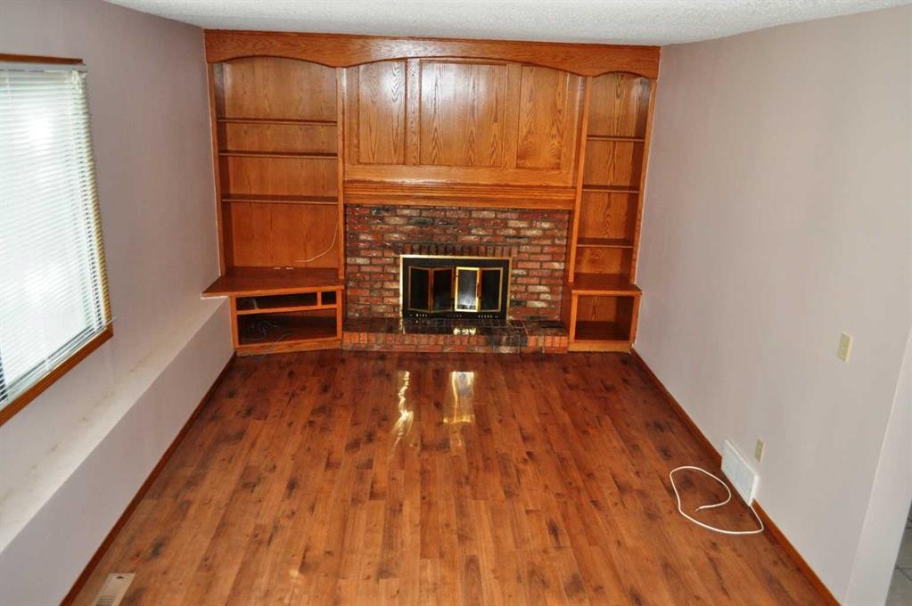 319 Woodside Circle Sw, Calgary, AB - Indoor With Fireplace