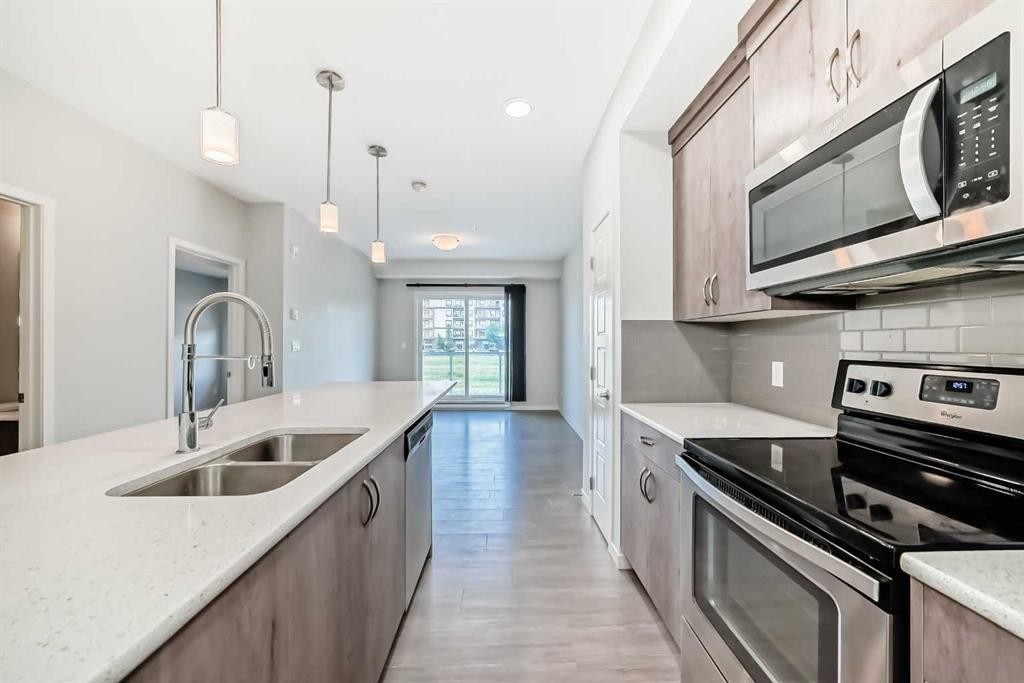 212-20 Seton Park Se, Calgary, AB - Indoor Photo Showing Kitchen With Double Sink With Upgraded Kitchen