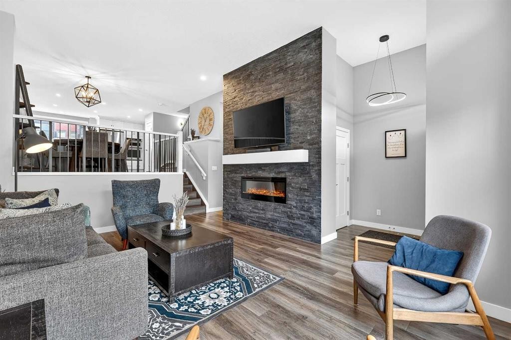 322 Masters Row Se, Calgary, AB - Indoor Photo Showing Living Room With Fireplace