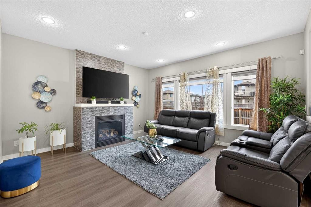 148 Walden Square Se, Calgary, AB - Indoor Photo Showing Living Room With Fireplace