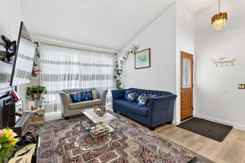 236 Mckerrell Way Se, Calgary, AB - Indoor Photo Showing Living Room