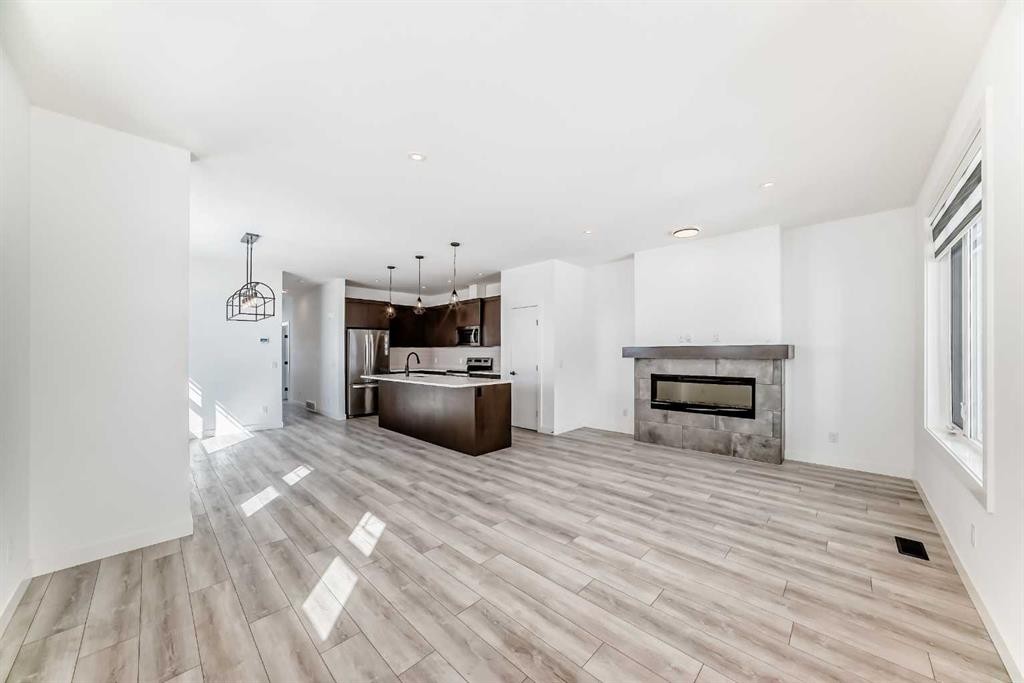 357 Calhoun Common Ne, Calgary, AB - Indoor Photo Showing Living Room With Fireplace