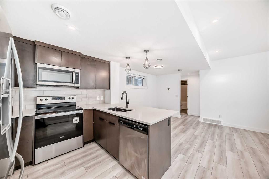 357 Calhoun Common Ne, Calgary, AB - Indoor Photo Showing Kitchen With Double Sink
