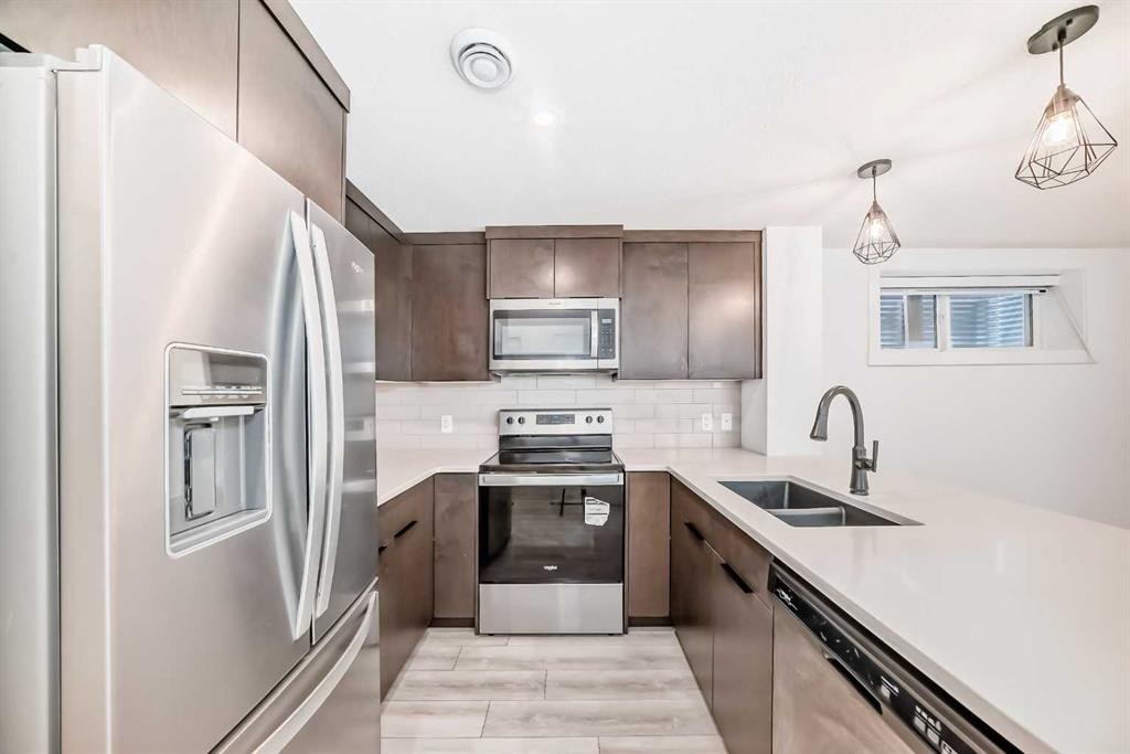 357 Calhoun Common Ne, Calgary, AB - Indoor Photo Showing Kitchen With Double Sink With Upgraded Kitchen