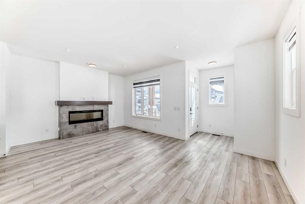 357 Calhoun Common Ne, Calgary, AB - Indoor Photo Showing Living Room With Fireplace