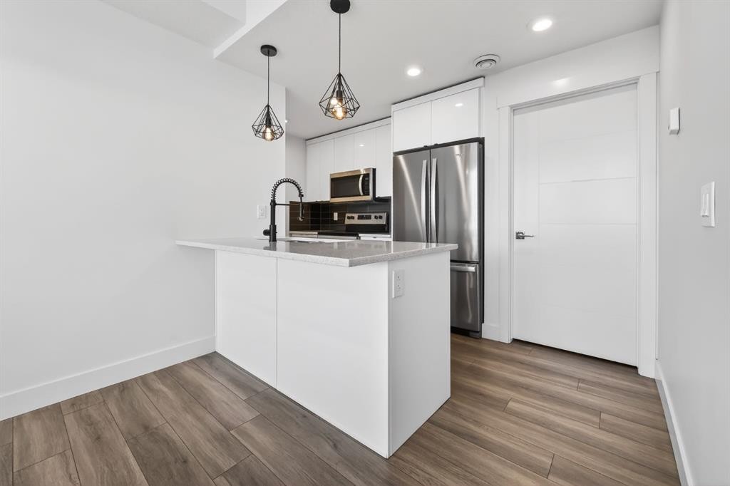 214 Seton Passage Se, Calgary, AB - Indoor Photo Showing Kitchen With Upgraded Kitchen