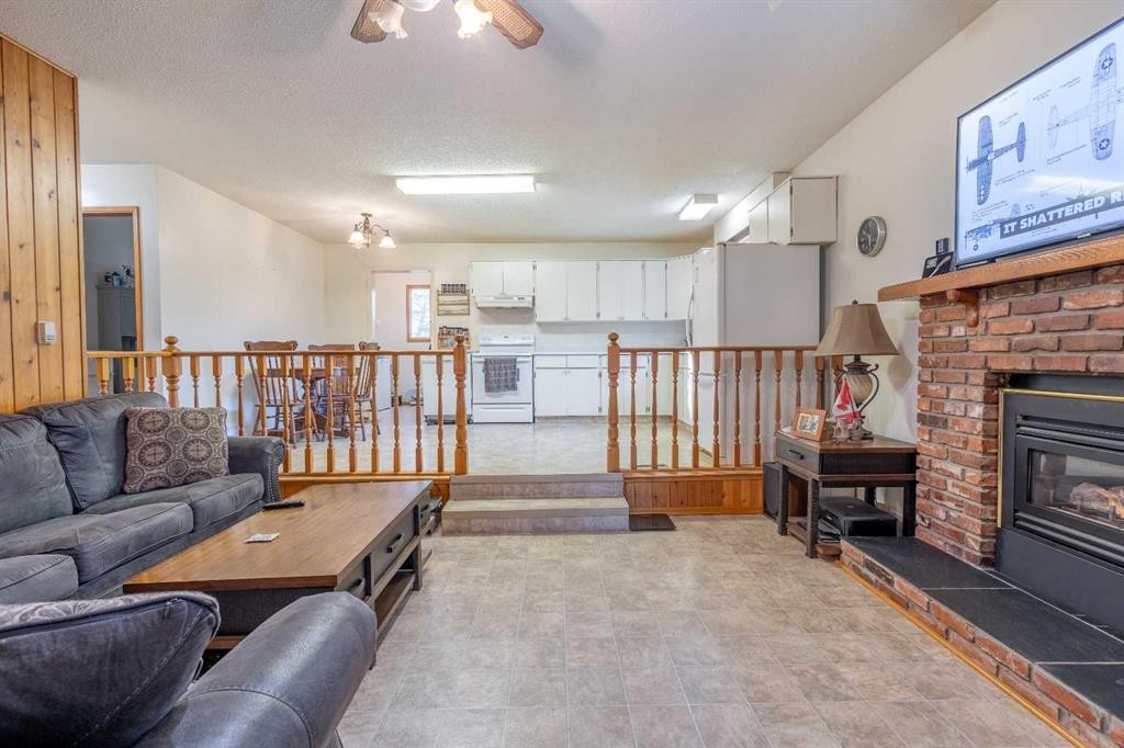 62 Buskmose Drive, Grandview, AB - Indoor Photo Showing Living Room With Fireplace