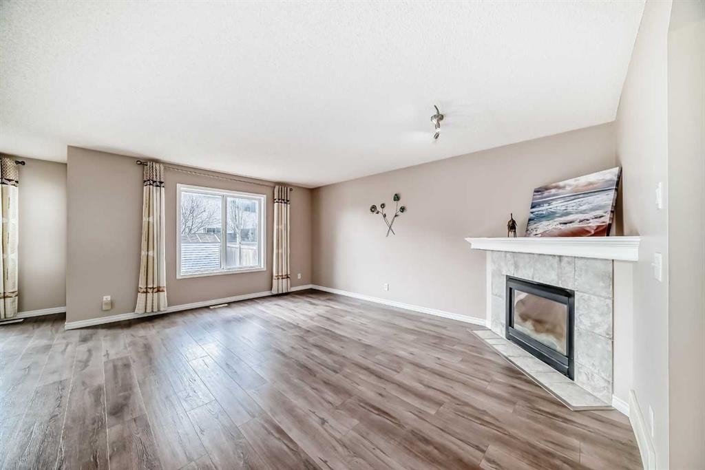 9 Somerside Crescent Sw, Calgary, AB - Indoor Photo Showing Living Room With Fireplace