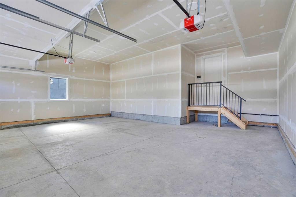230 Kinniburgh Loop, Chestermere, AB - Indoor Photo Showing Garage