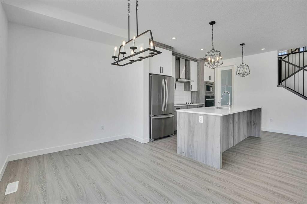 230 Kinniburgh Loop, Chestermere, AB - Indoor Photo Showing Kitchen With Upgraded Kitchen