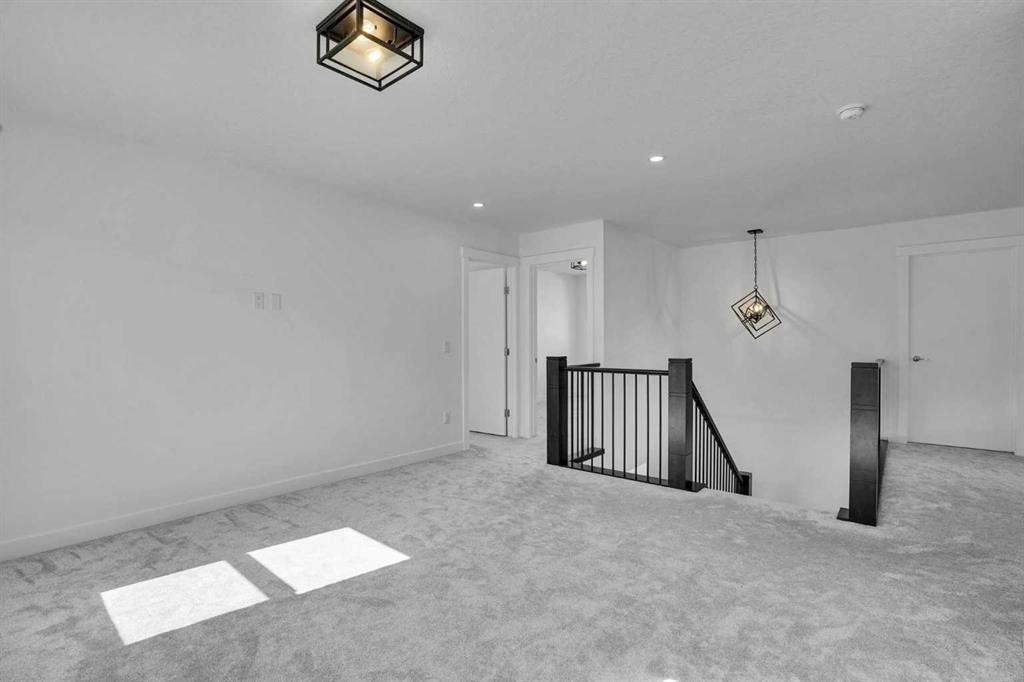 230 Kinniburgh Loop, Chestermere, AB - Indoor Photo Showing Other Room
