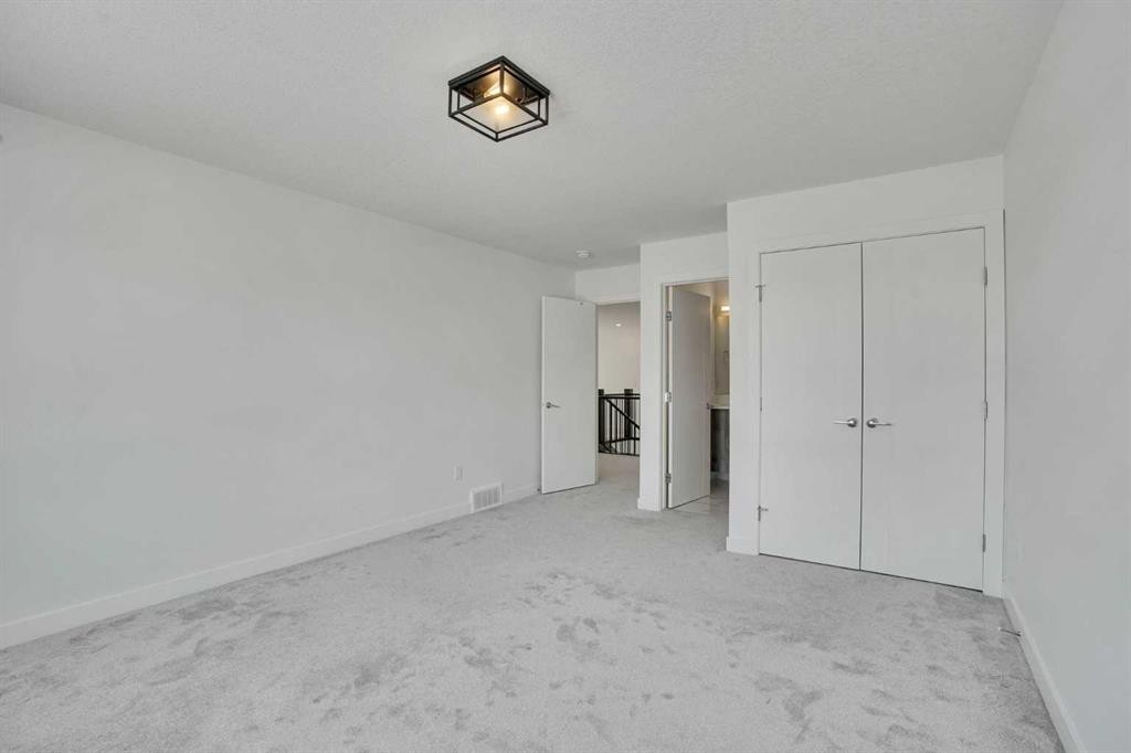230 Kinniburgh Loop, Chestermere, AB - Indoor Photo Showing Other Room