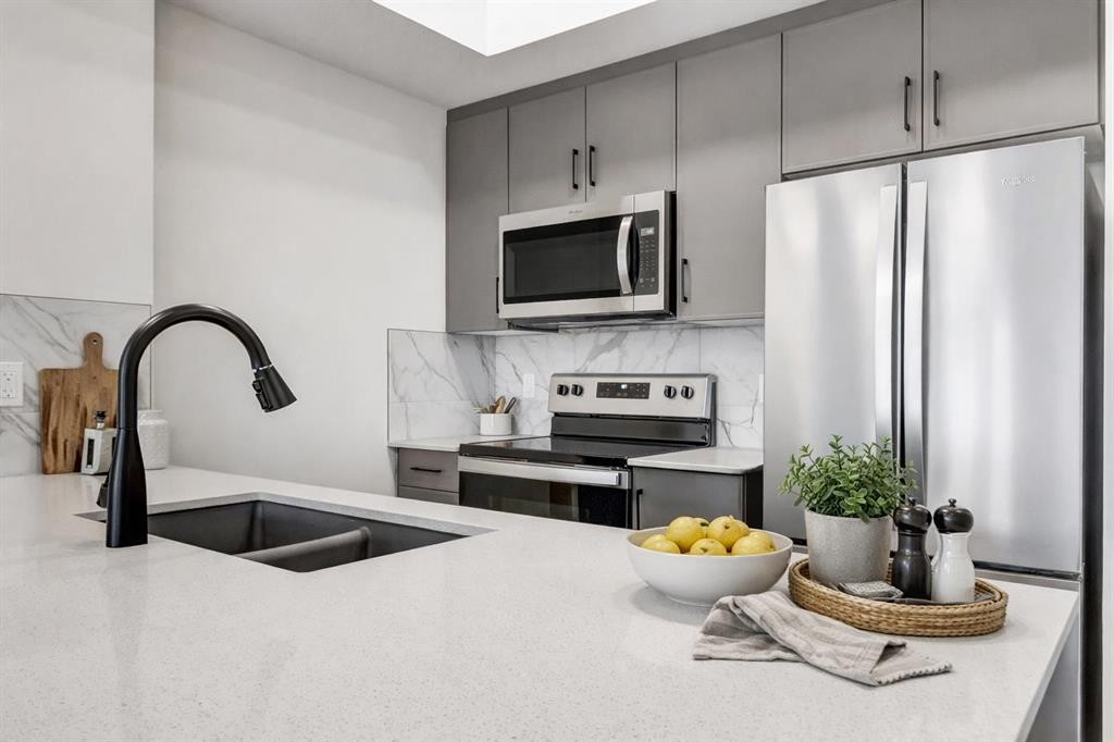 407-140 Mahogany Street, Calgary, AB - Indoor Photo Showing Kitchen With Stainless Steel Kitchen With Double Sink With Upgraded Kitchen