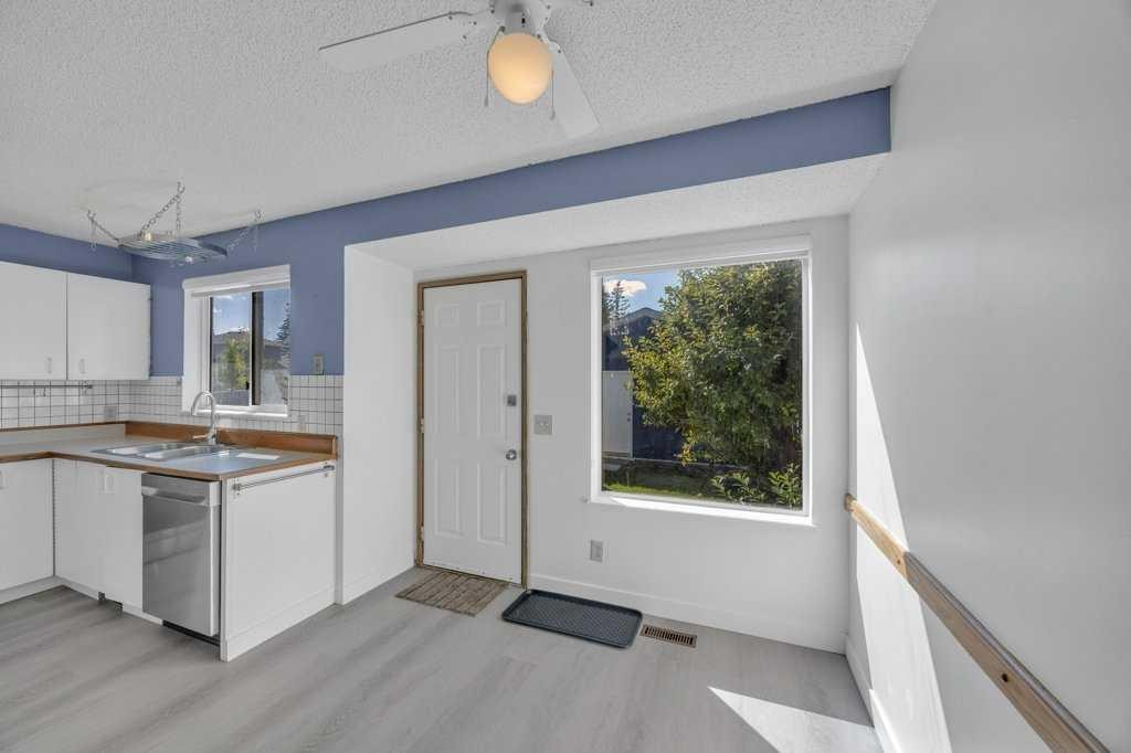 67 Martinwood Road Ne, Calgary, AB - Indoor Photo Showing Kitchen With Double Sink