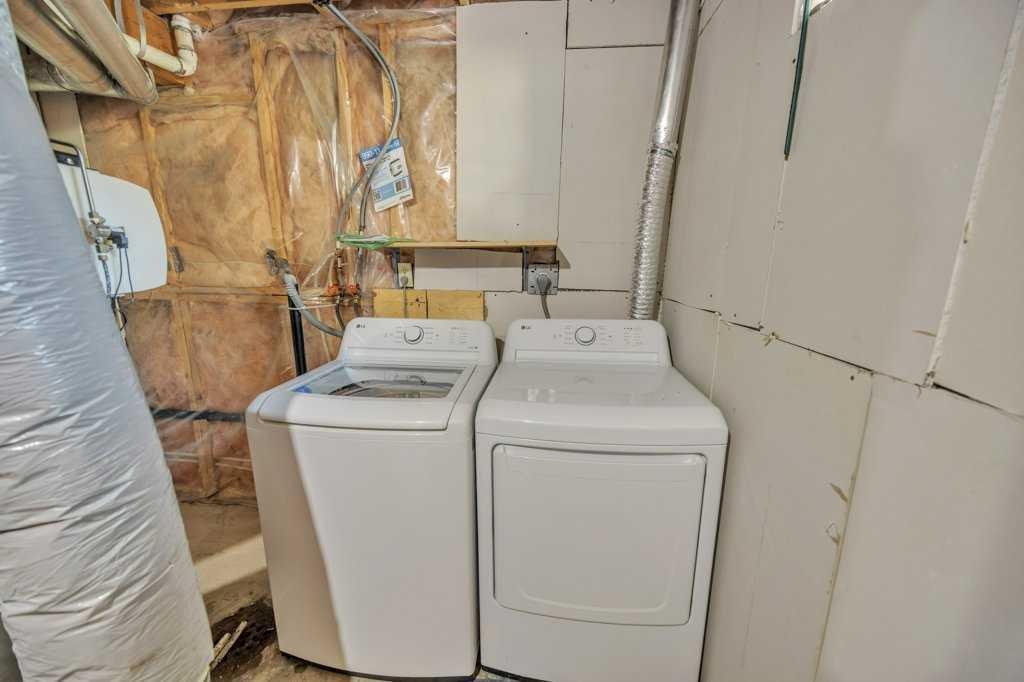 67 Martinwood Road Ne, Calgary, AB - Indoor Photo Showing Laundry Room