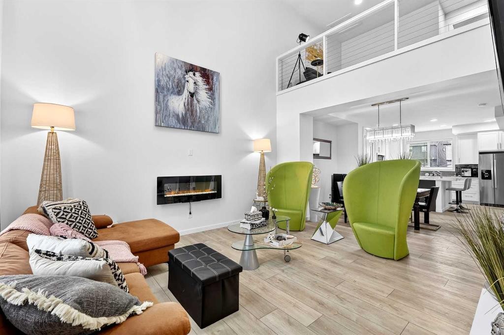 42 Heirloom Manor Se, Calgary, AB - Indoor Photo Showing Living Room With Fireplace