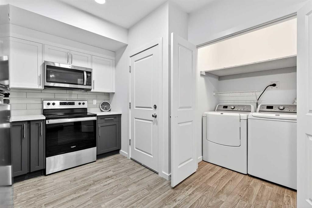 42 Heirloom Manor Se, Calgary, AB - Indoor Photo Showing Laundry Room