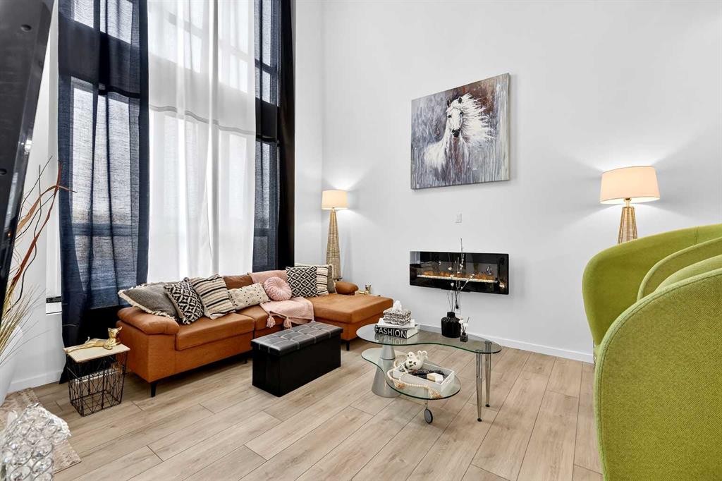 42 Heirloom Manor Se, Calgary, AB - Indoor Photo Showing Living Room With Fireplace