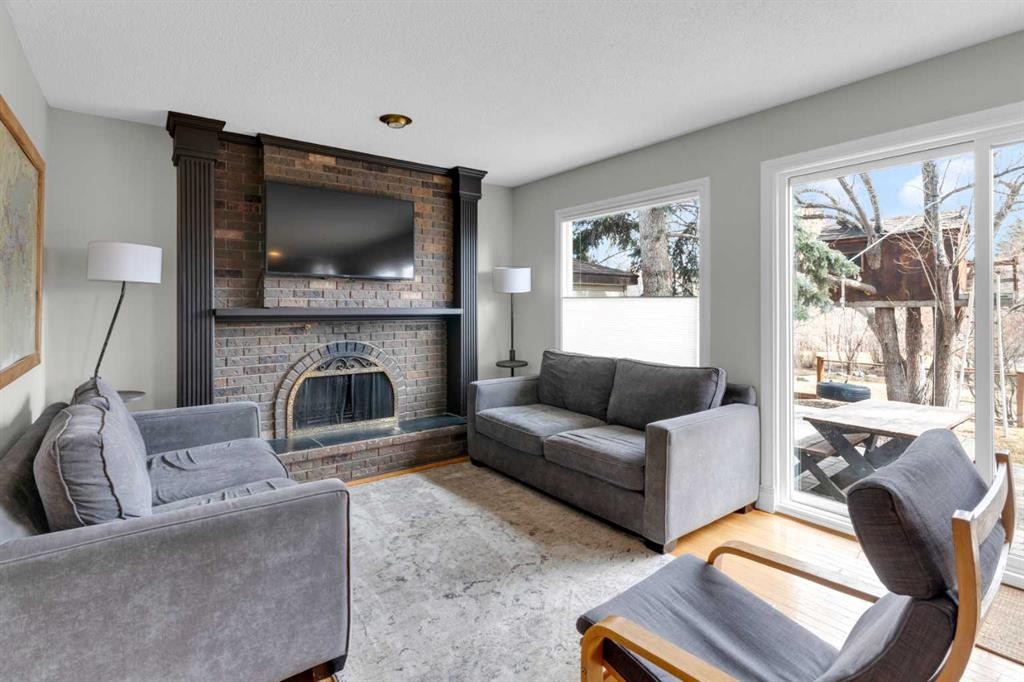 356 Cannington Place Sw, Calgary, AB - Indoor Photo Showing Living Room With Fireplace