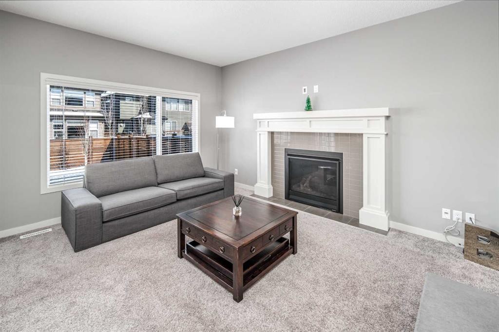80 Howse Manor Ne, Calgary, AB - Indoor Photo Showing Living Room With Fireplace