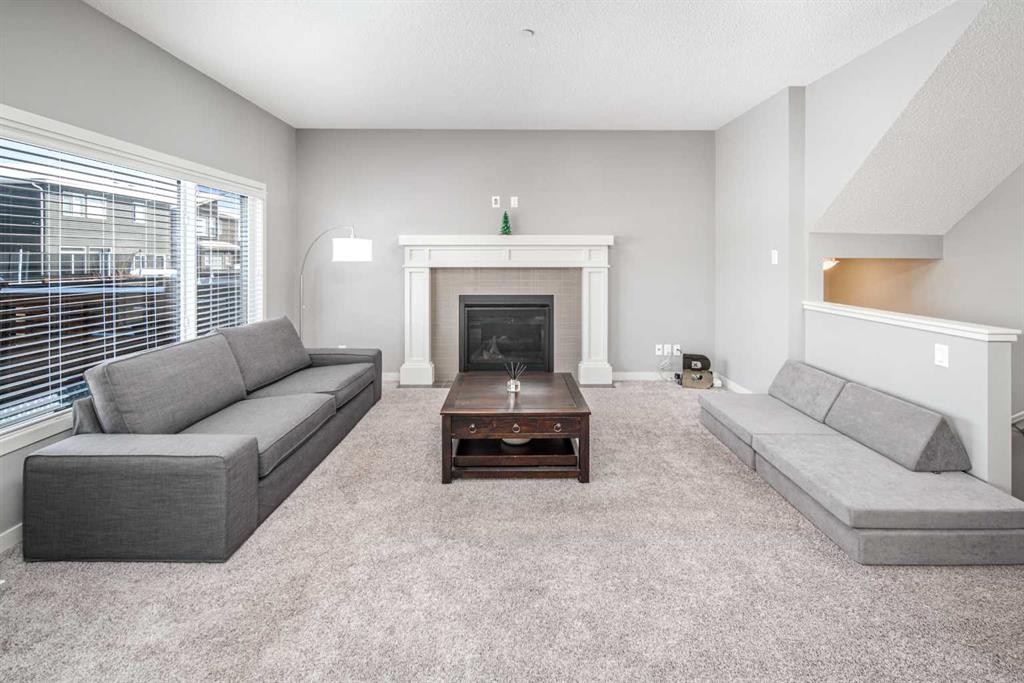 80 Howse Manor Ne, Calgary, AB - Indoor Photo Showing Living Room With Fireplace