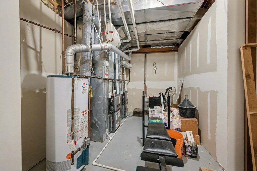16 Straddock Crescent Sw, Calgary, AB - Indoor Photo Showing Basement