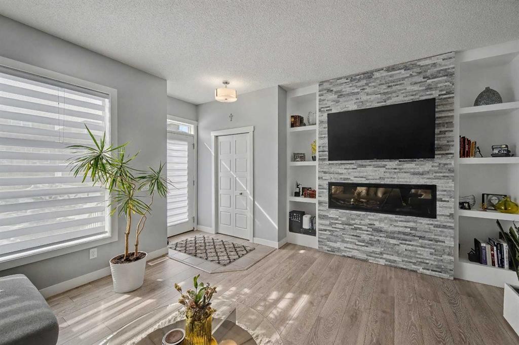 38 Sage Bluff Gate Nw, Calgary, AB - Indoor Photo Showing Living Room With Fireplace