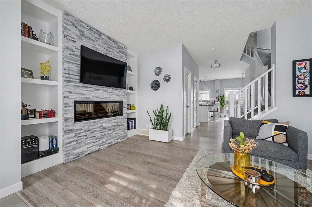 38 Sage Bluff Gate Nw, Calgary, AB - Indoor Photo Showing Living Room With Fireplace