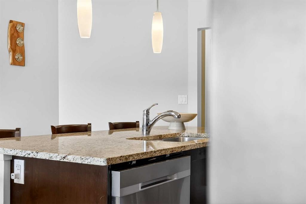 308-402 Marquis Lane Se, Calgary, AB - Indoor Photo Showing Kitchen With Double Sink