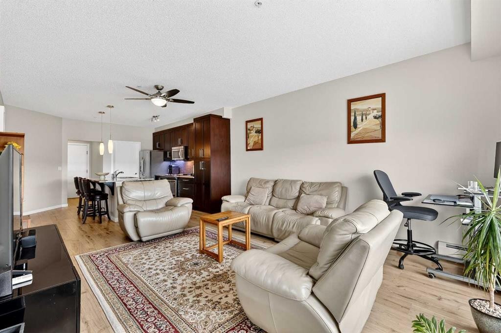 308-402 Marquis Lane Se, Calgary, AB - Indoor Photo Showing Living Room