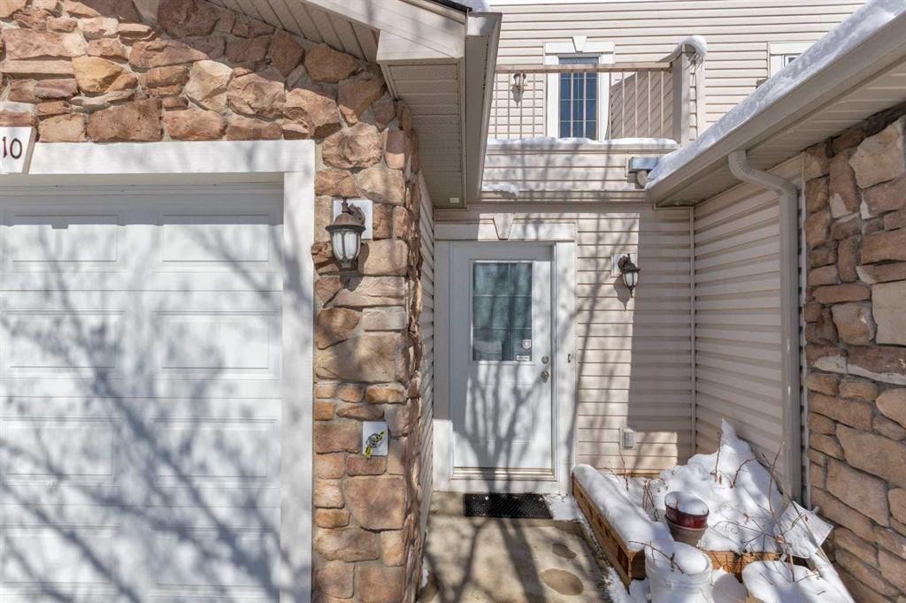 10 West Cedar Rise Sw, Calgary, AB - Outdoor With Fireplace