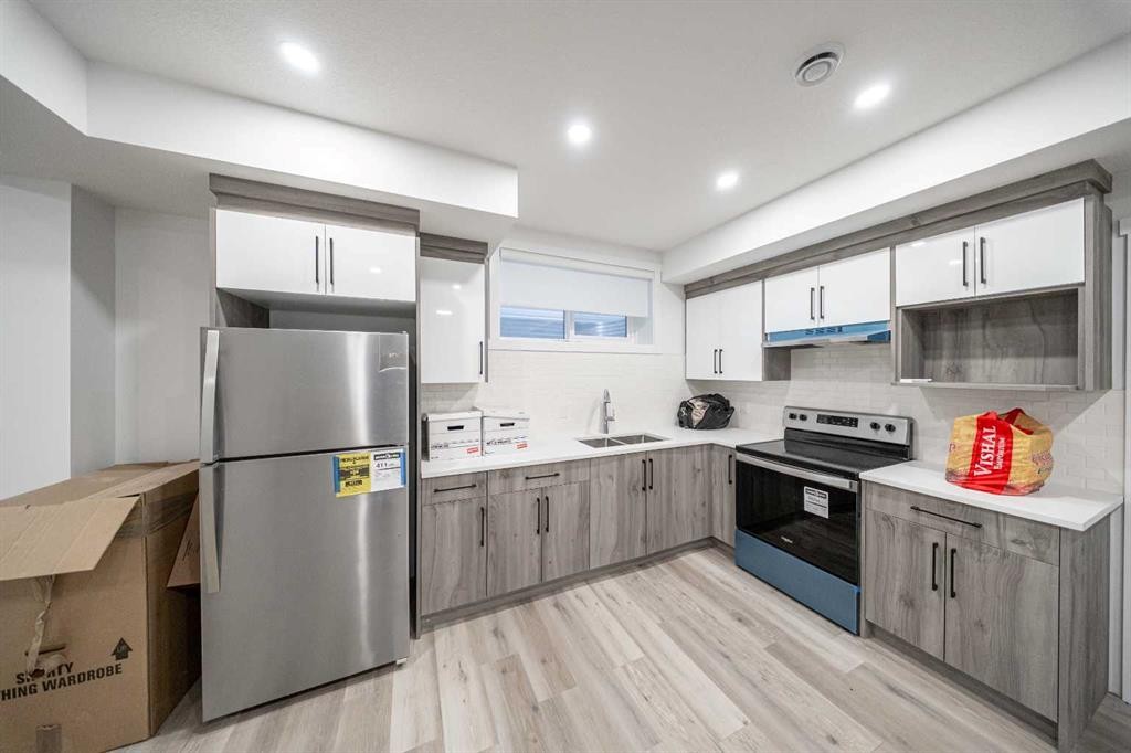 123 Saddlecrest Grove Ne, Calgary, AB - Indoor Photo Showing Kitchen With Stainless Steel Kitchen With Double Sink