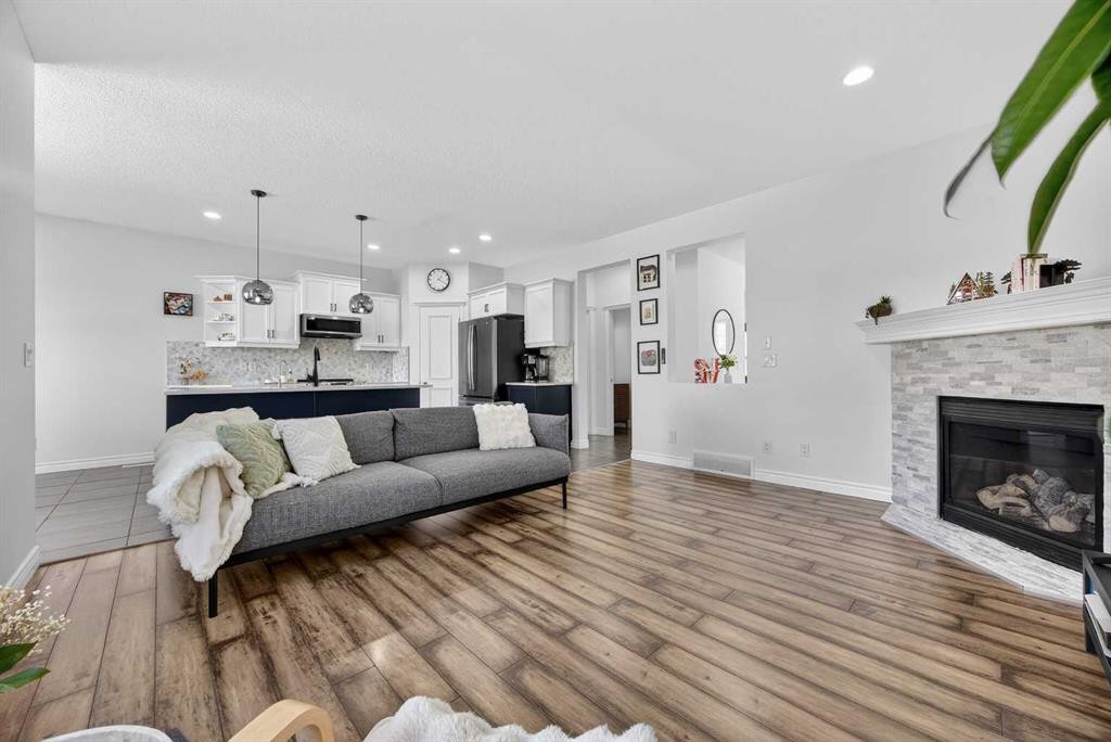 340 Prestwick Terrace Se, Calgary, AB - Indoor Photo Showing Living Room With Fireplace